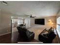 Inviting living room featuring hardwood floors and modern furnishings at 37341 Rutledge Dr, Zephyrhills, FL 33541
