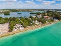 Aerial view of waterfront property with surrounding area at 3999 Casey Key Rd, Nokomis, FL 34275
