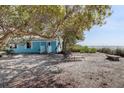Quaint beach cottage with lounge chairs and ocean views at 3999 Casey Key Rd, Nokomis, FL 34275