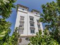 Beautiful exterior shot of Cassata Shores building with multiple floors and serene surroundings at 225 The Esplanade N. # 401, Venice, FL 34285
