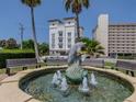 Charming fountain with dolphin sculptures in a landscaped area at 225 The Esplanade N. # 401, Venice, FL 34285