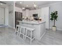Modern kitchen with a large island and stainless steel appliances at 934 E Venice Ave, Venice, FL 34285