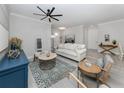 Bright living room featuring a comfy sofa and stylish coffee table at 934 E Venice Ave, Venice, FL 34285