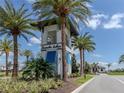 Community entrance with signage and landscaping at 1729 Lugano Cir, Nokomis, FL 34275