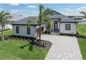Luxury home with tile roof and paver driveway at 1729 Lugano Cir, Nokomis, FL 34275