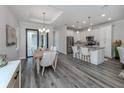 Open dining area with wood table and access to kitchen at 922 E Venice Ave, Venice, FL 34285