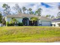 House exterior with a large yard at 4343 Carver St, North Port, FL 34286