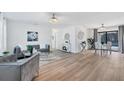 Open concept living and dining area with hardwood floors at 18091 Eau Gallie Cir, Port Charlotte, FL 33948
