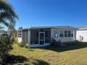 Mobile home with screened porch and spacious yard at 517 Via Veneto, Venice, FL 34285