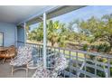 Relaxing screened balcony overlooking lush greenery at 454 Cerromar Rd # 275, Venice, FL 34293