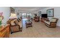 Bright and airy living room with wicker furniture and tile floors at 601 Shreve St # 51B, Punta Gorda, FL 33950