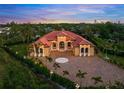 Stunning property showcasing a large home and mature landscaping at 2340 Bayshore Rd, Nokomis, FL 34275