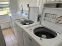 Shared laundry facility with multiple washers and dryers at 519 Albee Farm Rd # 317, Venice, FL 34285