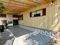 Covered patio with wood beams and concrete flooring at 5220 Palena Blvd, North Port, FL 34287