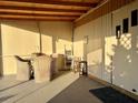 Covered patio furnished with wicker chairs and a table at 5220 Palena Blvd, North Port, FL 34287