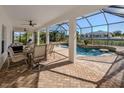 Relaxing pool area with covered patio, outdoor dining, and seating at 14462 Fort Worth Cir, Port Charlotte, FL 33981