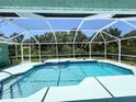 Inviting screened-in pool with ample deck space at 2454 Sonoma W Dr, Nokomis, FL 34275
