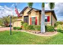 One-story home with brick driveway and red shutters at 15328 Mille Fiore Blvd, Port Charlotte, FL 33953