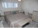 Spacious bedroom with king-size bed and ample storage at 409 Manatee Ct # 206, Venice, FL 34285