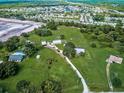 Aerial view of property showing home, outbuildings, and large lot at 1109 Twin Laurel Blvd, Nokomis, FL 34275