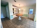 Round dining table with built-in hutch at 257 Palm Harbor Dr, North Port, FL 34287