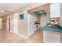 Bright kitchen features white appliances and teal countertops at 3460 Shamrock Dr, Venice, FL 34293