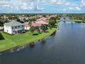 House on a lake with backyard and community view at 12002 Granite Woods Loop, Venice, FL 34292