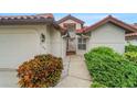 Inviting exterior with walkway, landscaping, and a two-car garage at 1188 Harbor Town Way, Venice, FL 34292