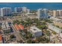 Aerial view showcasing a building's location in a bustling urban setting near the water at 332 Cocoanut Ave # 503, Sarasota, FL 34236