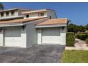 Two-car garage with ample parking space and easy access at 600 Carriage House Ln # 104, Nokomis, FL 34275