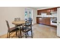 Small kitchen with wood cabinets and a round table at 401 Peach St, Venice, FL 34285