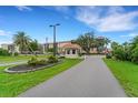 Gated community entrance with guardhouse at 25188 Marion Ave # D403, Punta Gorda, FL 33950