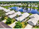 Community view with lake access and many homes at 803 Harrington Lake N Dr # 75, Venice, FL 34293