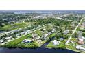 Aerial view showcasing home's location in a residential neighborhood near the water at 6 Cove Ln, Englewood, FL 34223