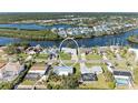 House nestled in a waterfront community with canal access at 703 Portia N St, Nokomis, FL 34275