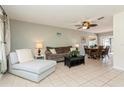 Bright living room featuring a chaise lounge and dining area at 18069 Ohara Dr, Port Charlotte, FL 33948