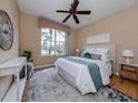 Bright bedroom with large window, and neutral decor at 5221 Laurel Oak Ct, North Port, FL 34287