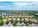 Aerial view of a community with lakefront properties at 19185 Mangieri St, Venice, FL 34293