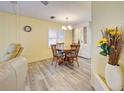 Charming dining area with a round table and built-in hutch at 628 Cervina Dr, Venice, FL 34285