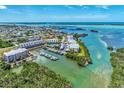 An aerial view of waterfront condos with private boat docks and easy Gulf access in a quiet Florida community at 1960 Oregon Trl # 3D, Englewood, FL 34224