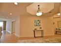 Elegant hallway with tile floors and neutral color palette at 6360 Watercrest Way # 203, Lakewood Ranch, FL 34202