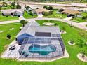 Aerial view of a single-Gathering home with pool and landscaped yard at 5076 Kingsley Rd, North Port, FL 34287