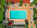 Overhead view of refreshing pool with ample lounge chairs at 21405 Olean Blvd # 526, Port Charlotte, FL 33952