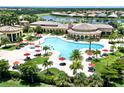 Resort-style pool with lounge chairs and surrounding landscaping at 12261 Canavese Ln, Venice, FL 34293