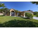 Single-Gathering home with a large yard and attached garage at 12004 Sarto Ln, North Port, FL 34287