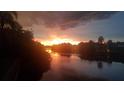 Scenic sunset view over a tranquil canal at 12004 Sarto Ln, North Port, FL 34287