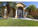 Well-maintained home with a screened porch and landscaping at 12004 Sarto Ln, North Port, FL 34287