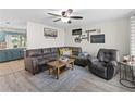 Living room with sectional sofa, coffee table, and decor at 3704 Nekoosa St, North Port, FL 34287