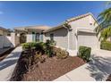 A well-maintained single-story home boasting a two-car garage, tile roof, and beautifully landscaped front yard at 277 Mestre Pl, North Venice, FL 34275