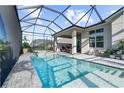 Inviting pool and patio area with covered lanai and spa at 8209 Redonda Loop, Lakewood Ranch, FL 34202